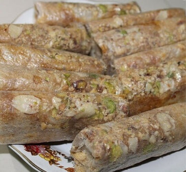 https://cdn.shopify.com/s/files/1/1857/6931/products/VellankiFoods-Papersweet_Dryfruit_Pootharekulu_Dryfruit_withJaggery.jpg?v=1737561043